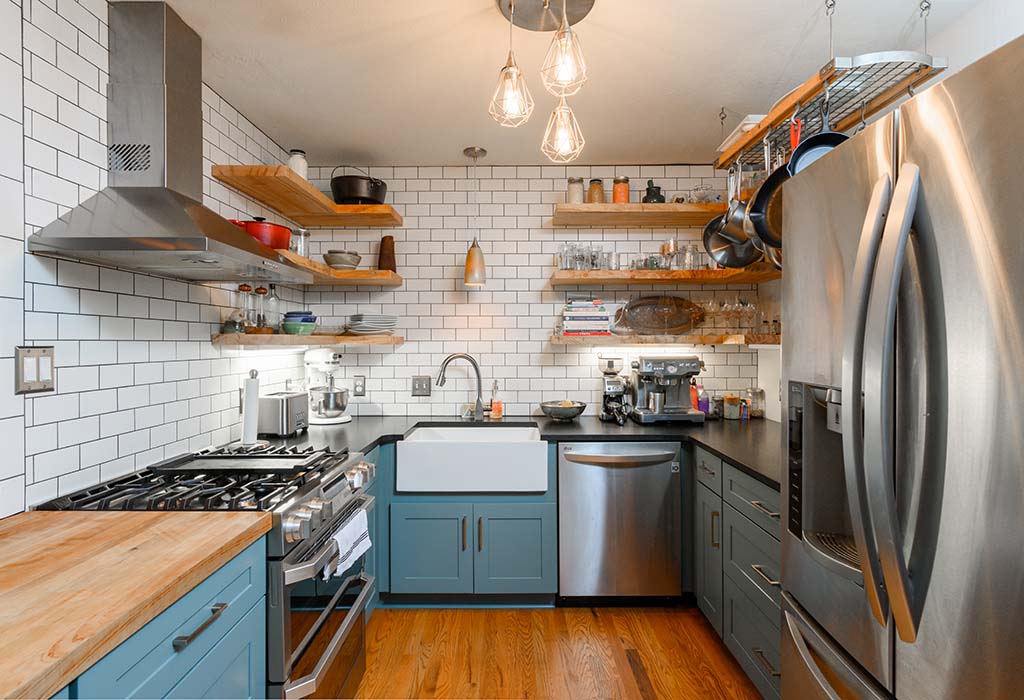 Modern Farmhouse Kitchen Remodel includes stainless steel appliances and a farmhouse sink