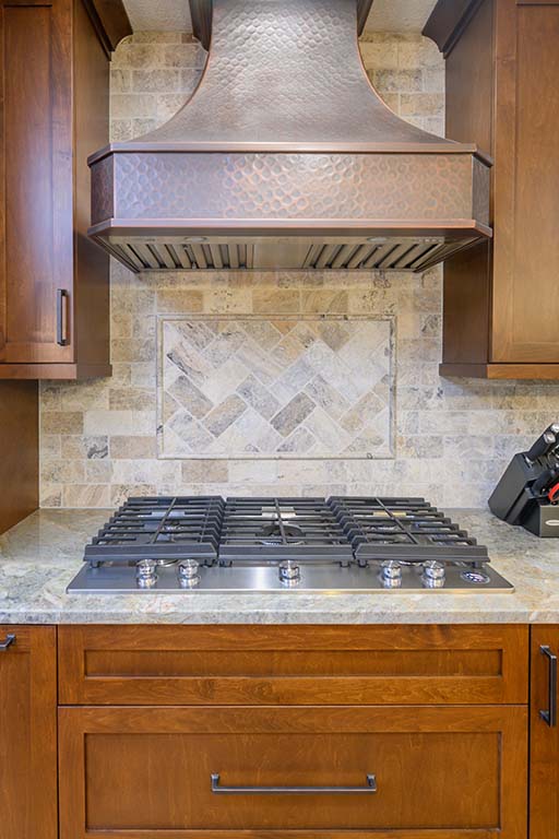 Copper vent hood creates a stunning center piece in this kitchen remodel