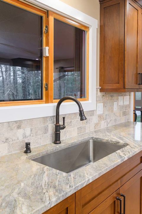 Recessed sink with antique nickel faucet