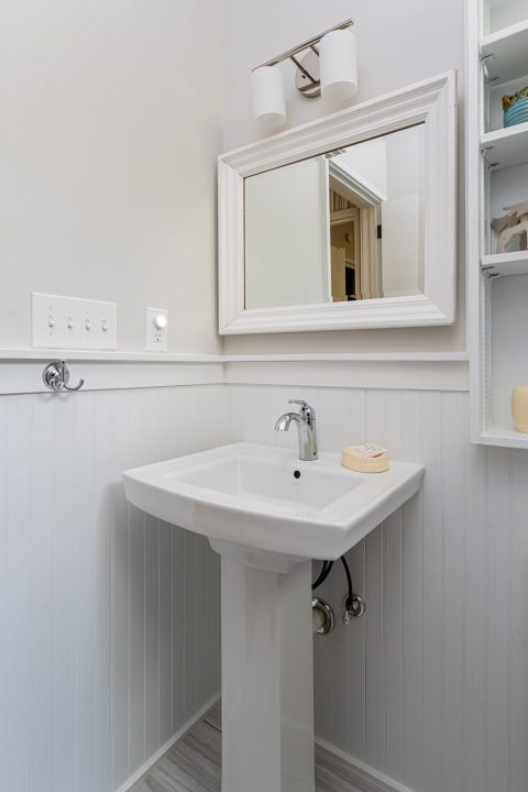 Pedestal sink with accent mirror in Whispering Pines, North Carolina.