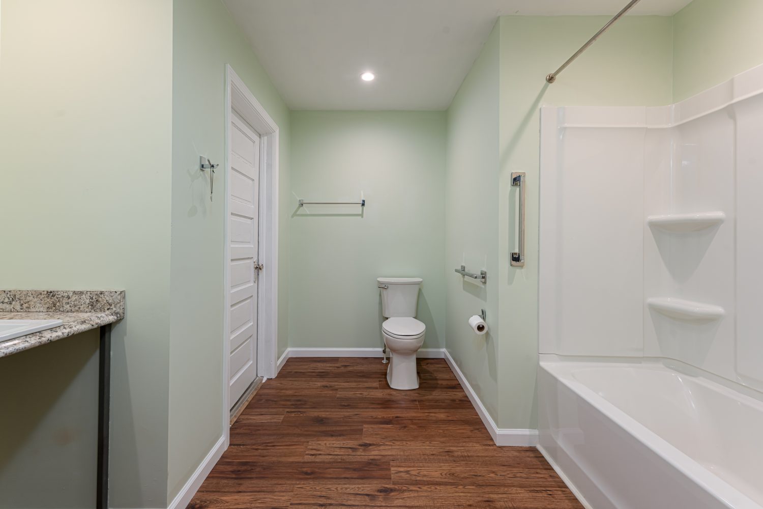 Sideview of bathroom showcasing toilet and shower in Montreat, North Carolina.