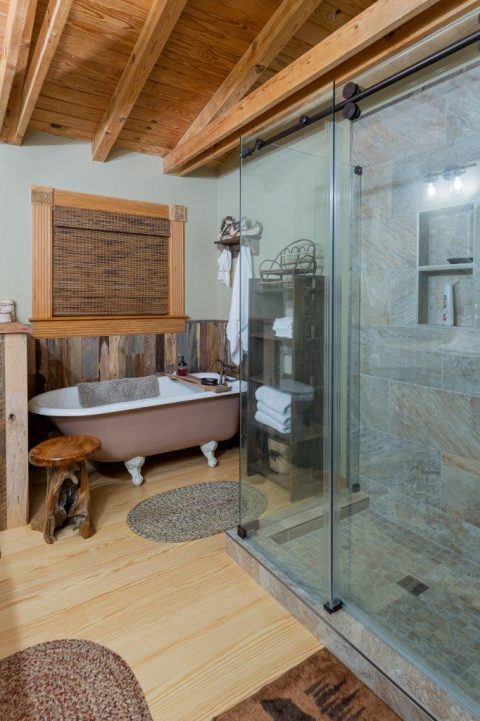 Bathroom showing white bathtub and glass shower in Black Mountain, North Carolina.