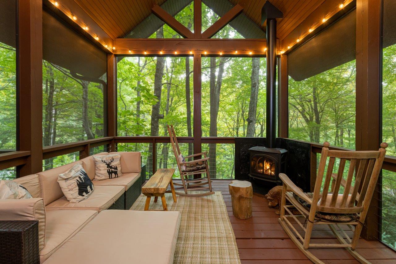Screened in porch with wood stove in Black Mountain, North Carolina.