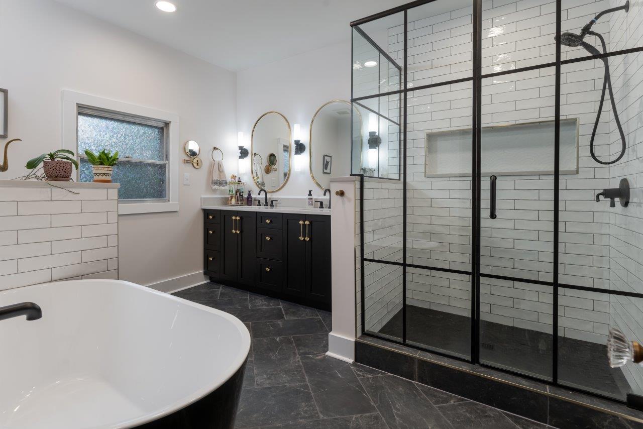 Side view of master bathroom showcasing herringbone pattern tile in Black Mountain, NC.