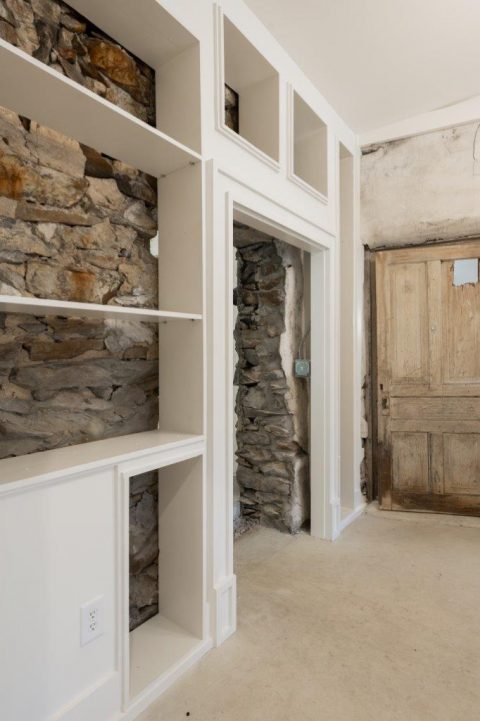Built in cabinetry with exposed rock wall in Black Mountain, North Carolina.