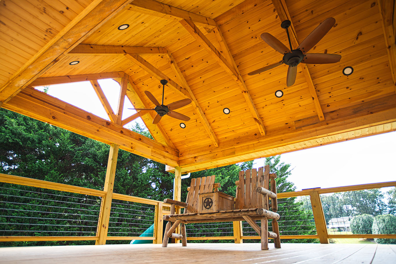 beautiful deck with bench and ceiling fans in nc