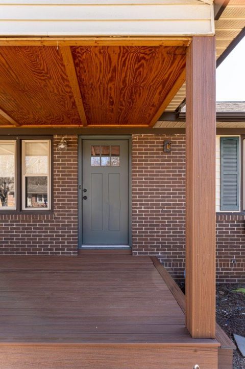 Detail view of front door on newly renovated front porch in Asheville, North Carolina.