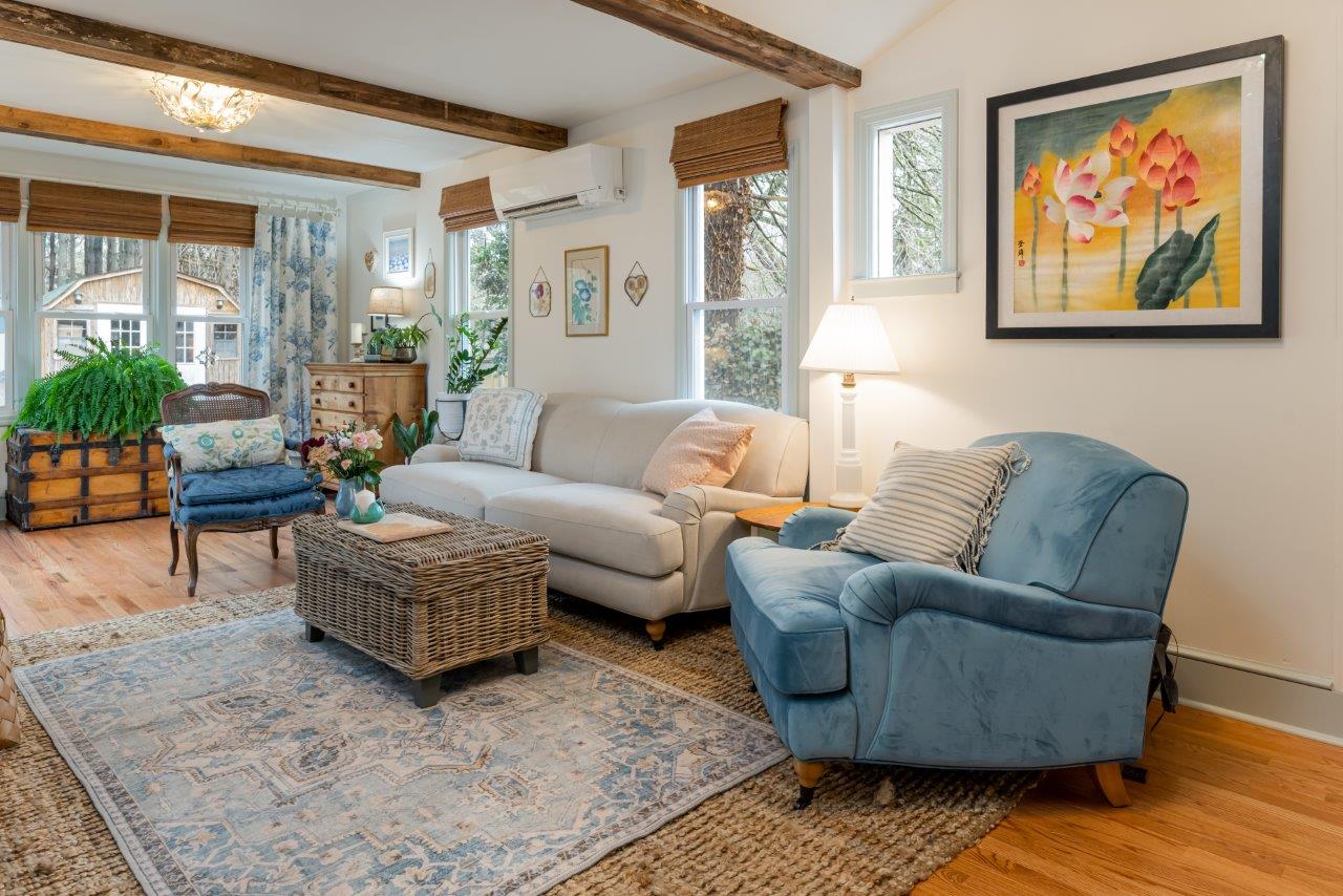 Living Room showcasing wrapped ceiling beams